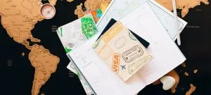 A map with some papers and a visa on it.