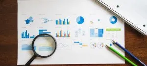 A picture of a magnifying glass on paper.