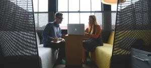 The woman helps her friend to answer the question "How to optimize your business relocation?".