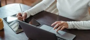 A man working on a laptop.