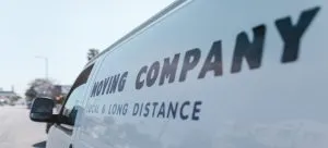 A van with a sticker "Moving company".