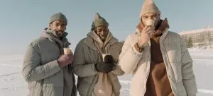 Three man standing and adapting to Canadian weather after moving from Hong Kong..