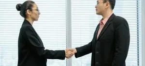 a man and a woman shaking hands