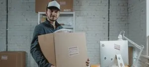 Affordable office relocation services mover with packed boxes