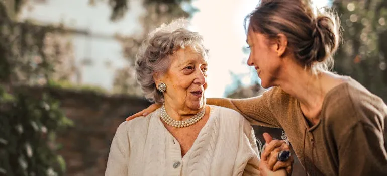 An old woman talking to her daughter