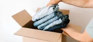 Man packing in moving box