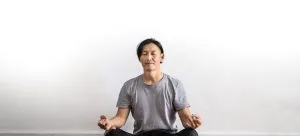 A man meditating.