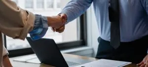 A handshake during the job interview. Plenty of job options are one of the reasons why families are moving from Hong Kong to Canada.