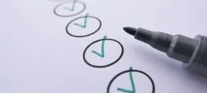 A marker near checked circles.