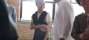 Two people shaking hands.