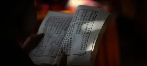 A person reading Mandarin. When artists move to Hong Kong, they should learn the basics of the language.