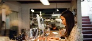 A woman working in a pub.