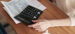 A person using a calculator.