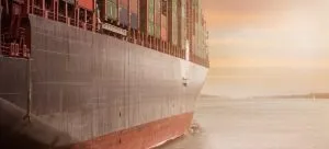 A boat with shipping containers.